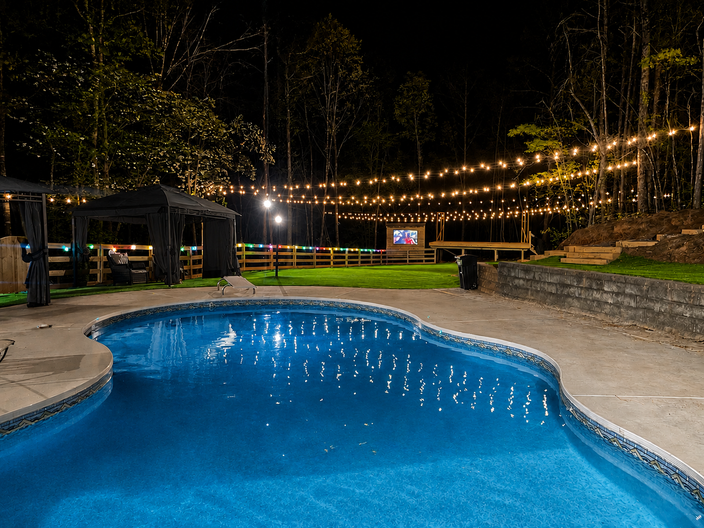 Nighttime poolside lights and outdoor ambience at Oasis Cove ATL